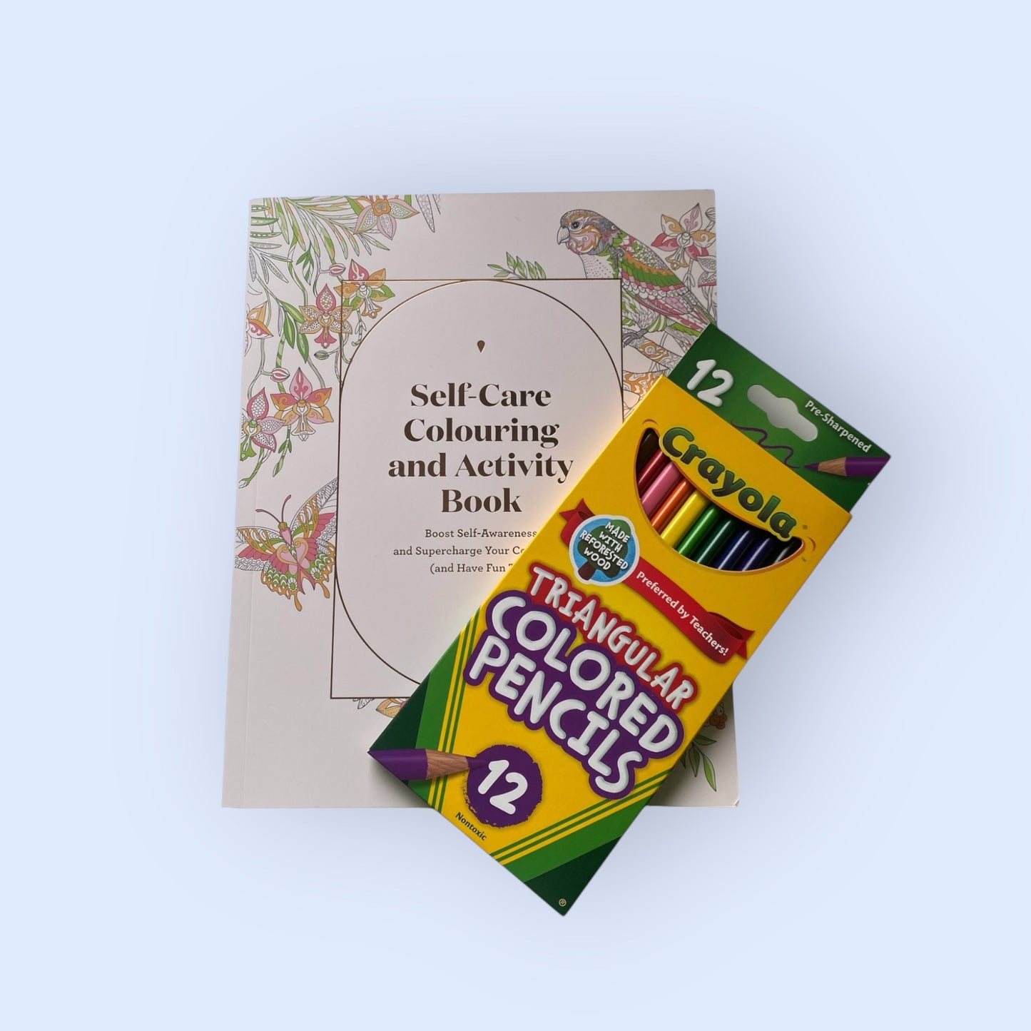 Self care colouring book and crayola colouring pencils.