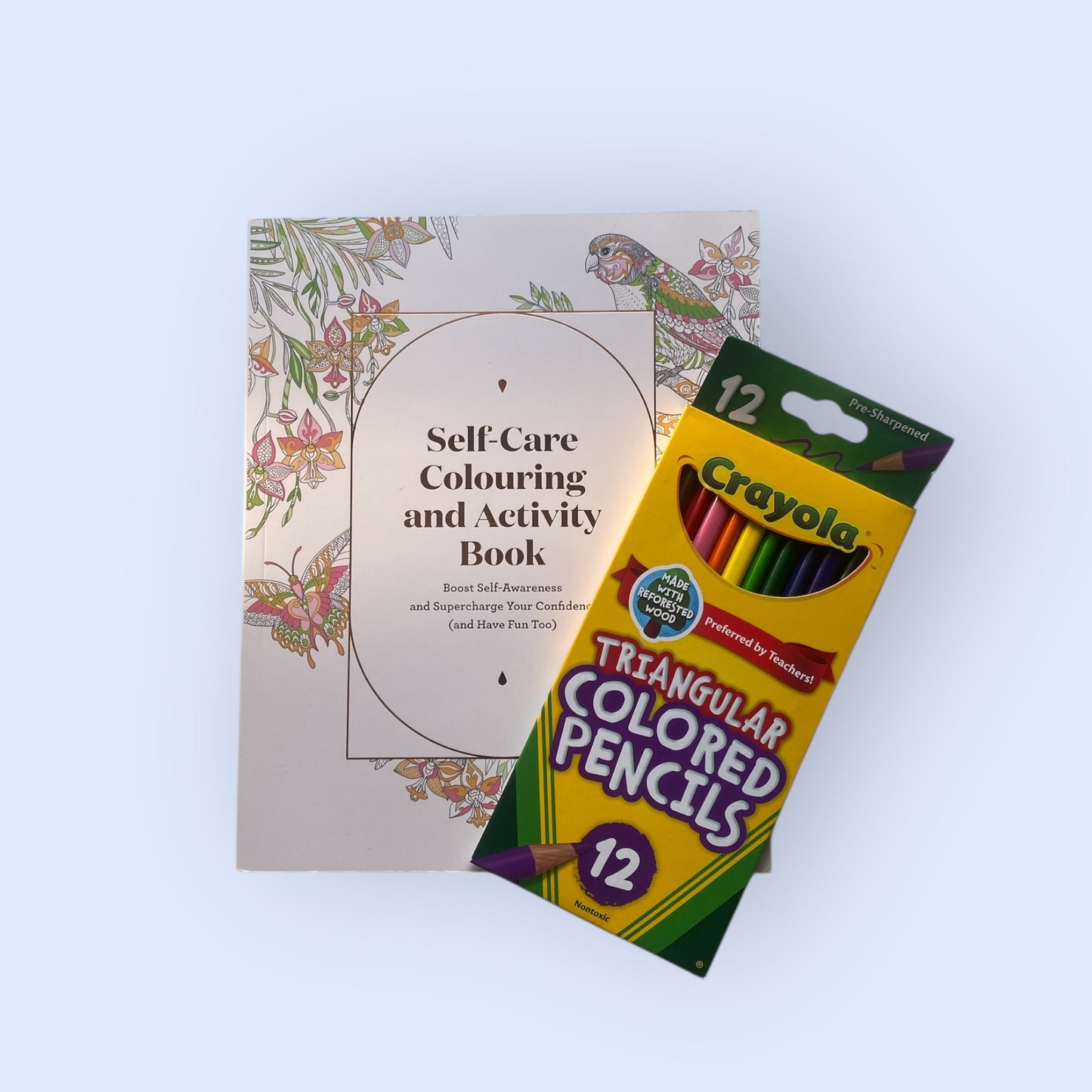 Self care colouring and activity book with crayola colouring pencils.