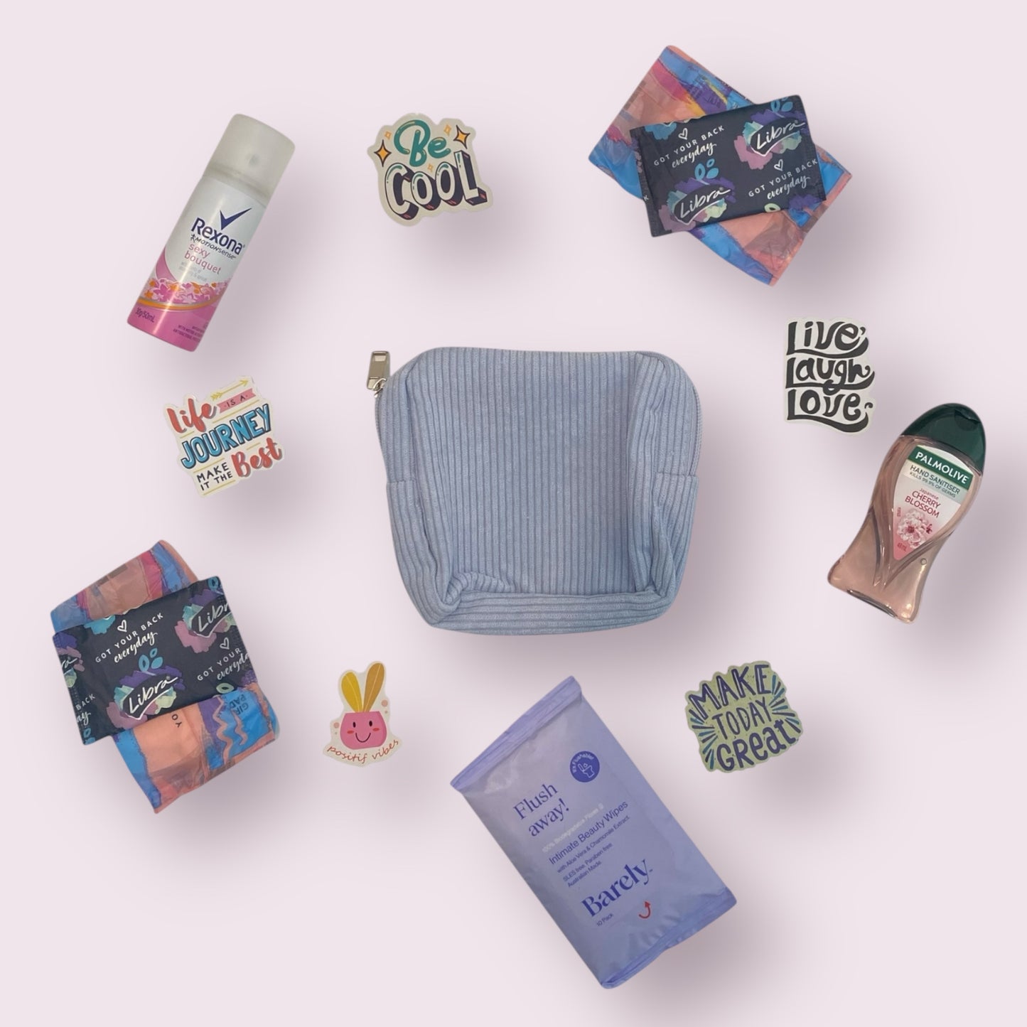 Purse, mini spray, pads, hand sanitiser and flushable wipes