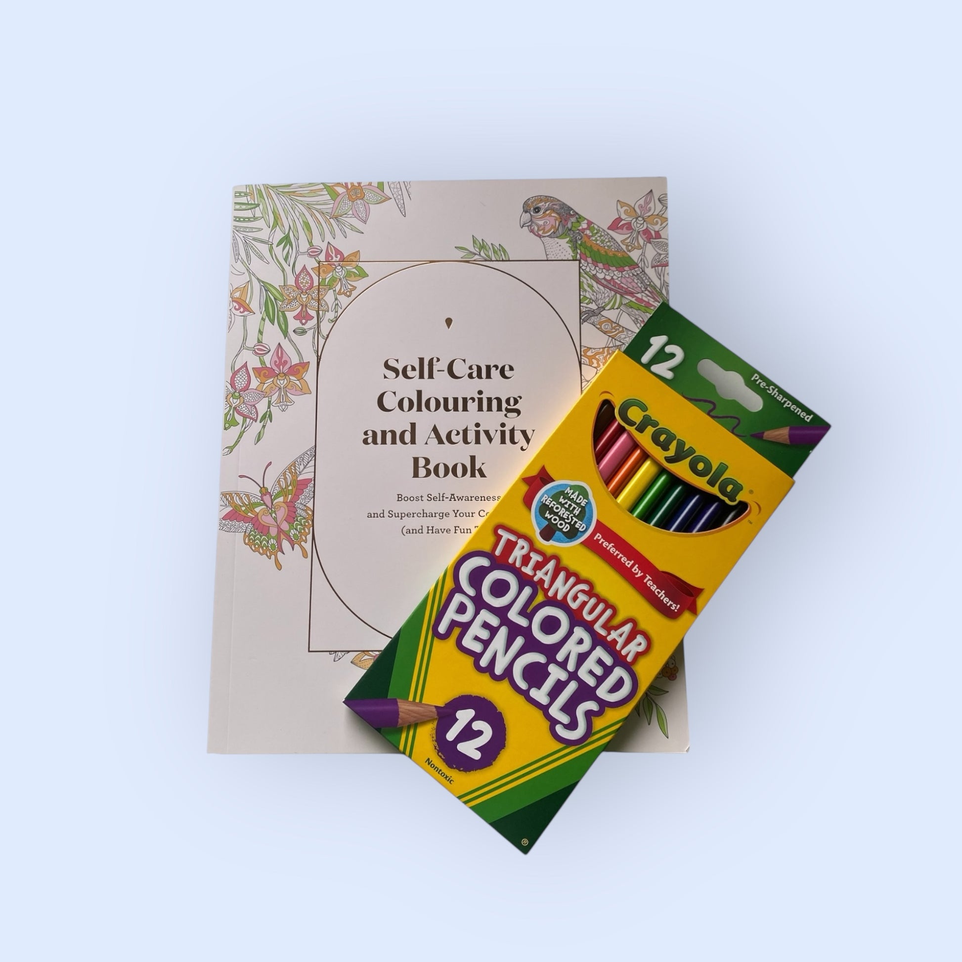 Self care colouring book and crayola colouring pencils.