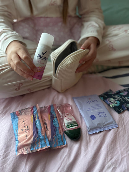 Purse, mini spray, hand sanitiser, pads and flushablw wipes.