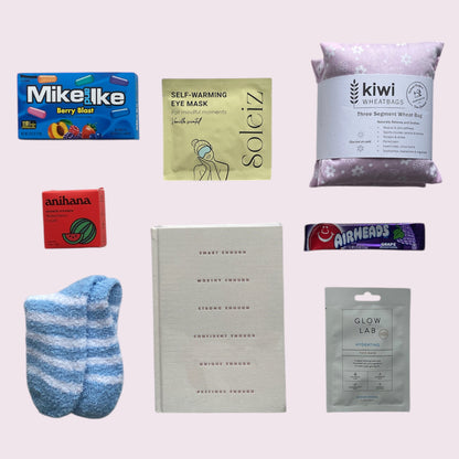 Contents of gift box include American candy, Soleiz eye mask, kiwi wheat bag, Anihana shower steamer, fluffy socks, I am enough journal, air heads candy and glow lab face mask. 